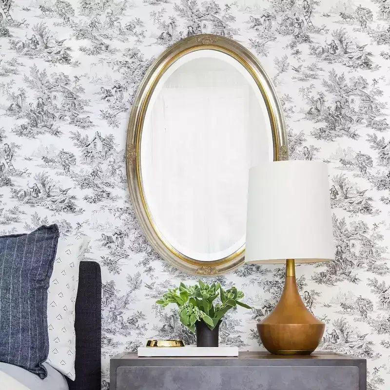 Espejo de pared ovalado con marco de madera dorado y plateado, detalle de volutas talladas, 31.5"