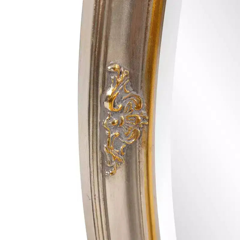 Espejo de pared ovalado con marco de madera dorado y plateado, detalle de volutas talladas, 31.5"